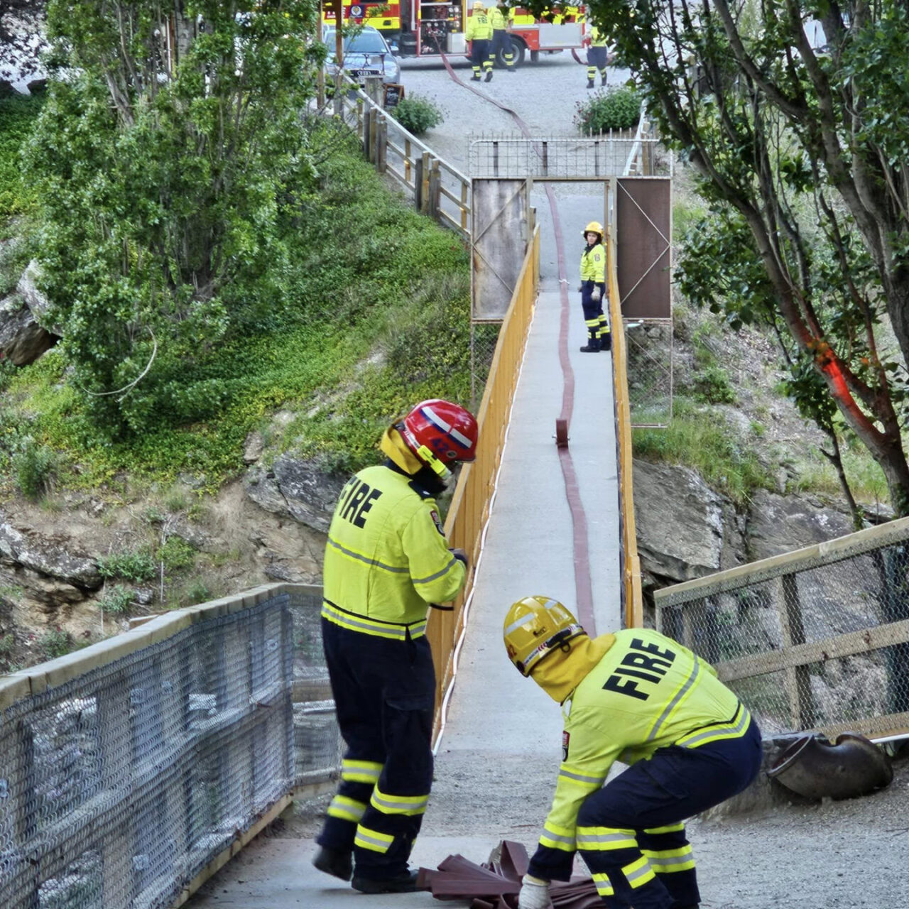 Fire brigade rolling out a fire hose